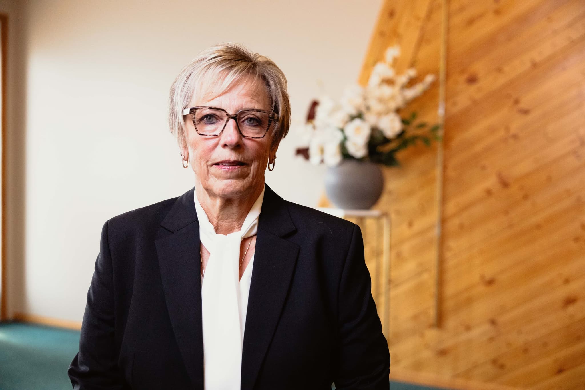 A funeral director at Athabasca Community Chapel standing in the chapel